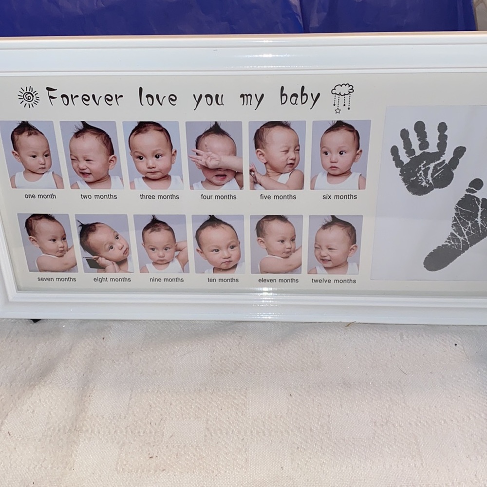 Picture Frame for each month of baby’s development plus hand & footprint